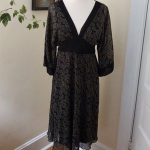 Pretty 3/4  sleeve dress with tie back.